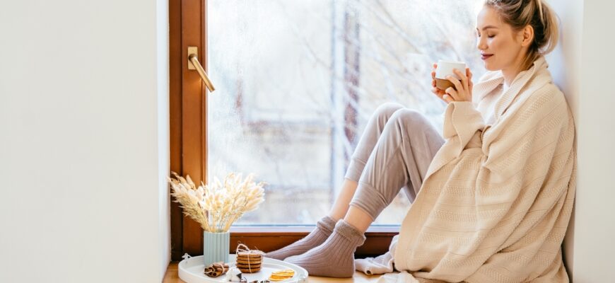 Happy,Blond,Woman,With,Bunch,Hairstyle,Warming,And,Cover,Knitted